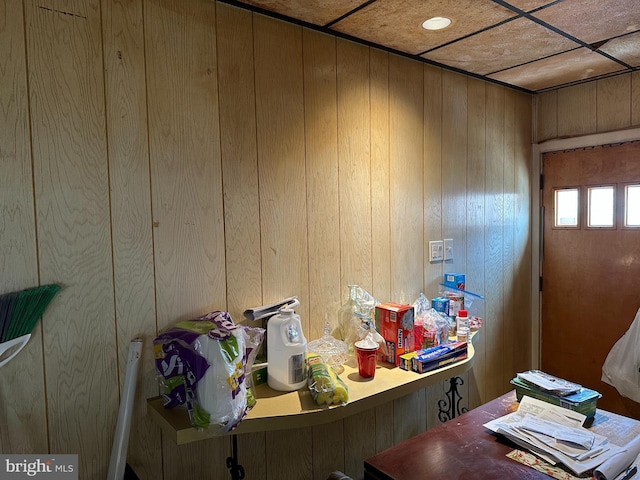 home office featuring wood walls