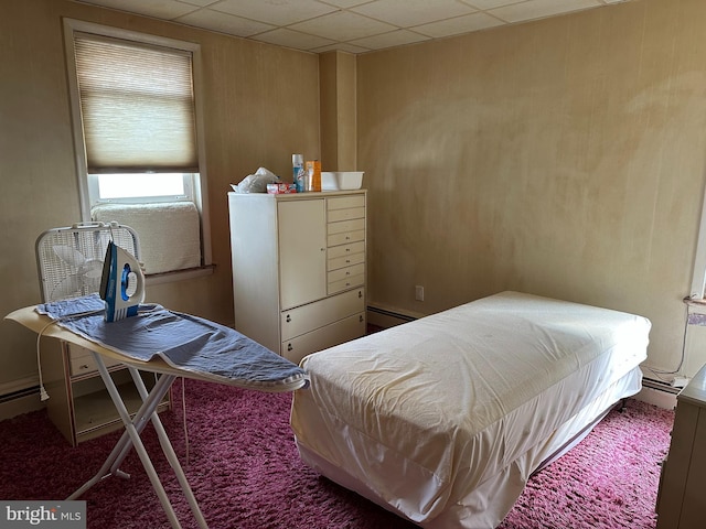 bedroom featuring a baseboard heating unit