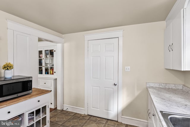 kitchen with white cabinets and sink