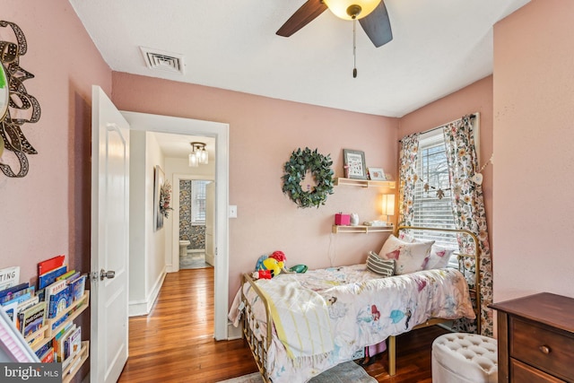 bedroom featuring ceiling fan and hardwood / wood-style flooring