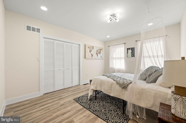 bedroom featuring light hardwood / wood-style floors and a closet