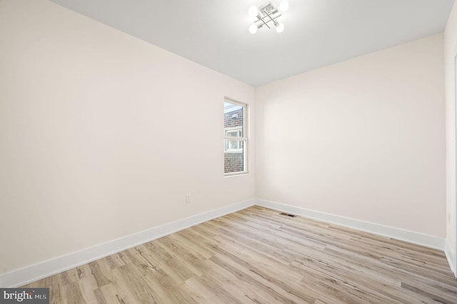 unfurnished room featuring light hardwood / wood-style floors