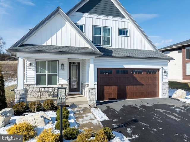 view of front of home featuring a garage and covered porch