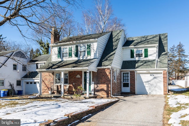 front of property with a garage and a porch