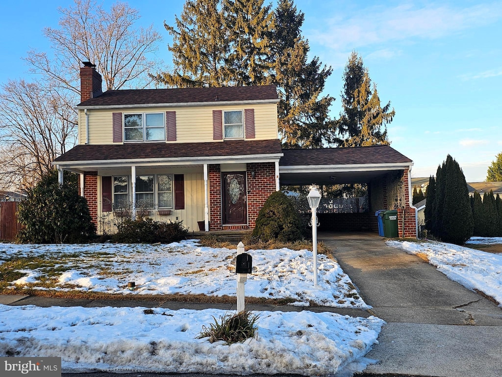 front facade with a carport