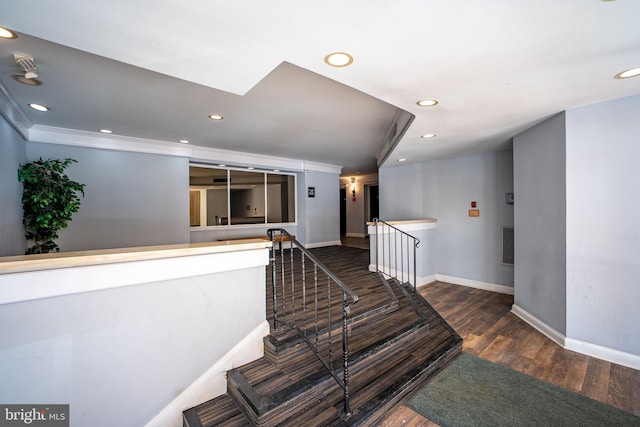 staircase featuring wood-type flooring