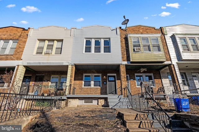 townhome / multi-family property with ceiling fan