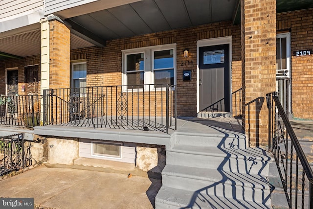 property entrance with covered porch