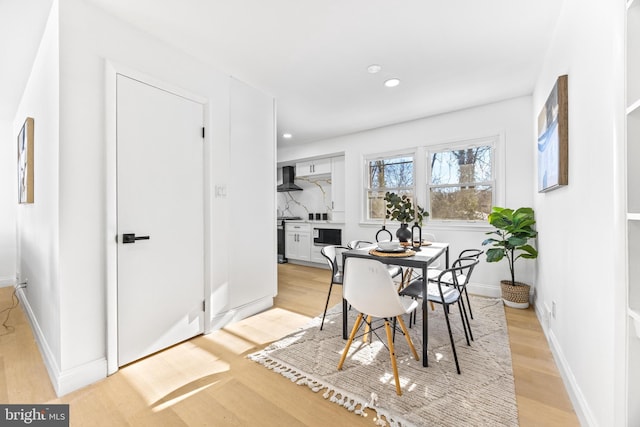 dining room featuring light hardwood / wood-style floors