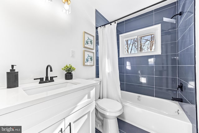 full bathroom with vanity, toilet, and shower / tub combo