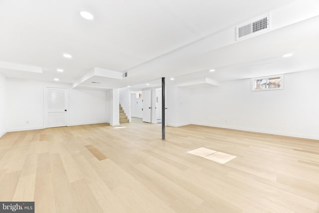 basement featuring light hardwood / wood-style flooring