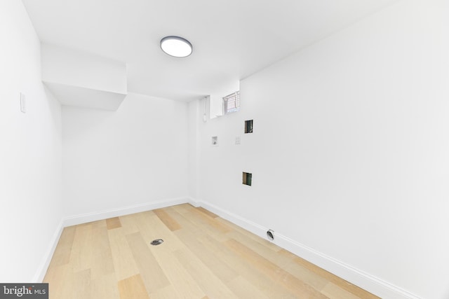 laundry area with hookup for a washing machine and hardwood / wood-style floors