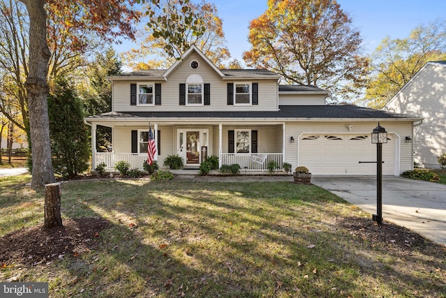 view of property with a porch, a front lawn, and a garage