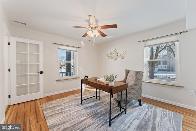 office space with ceiling fan and hardwood / wood-style floors