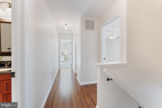 corridor featuring wood-type flooring