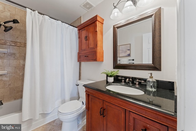 full bathroom featuring vanity, tile patterned flooring, shower / bath combo with shower curtain, and toilet
