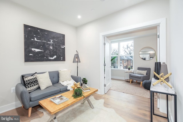 living room with light hardwood / wood-style floors