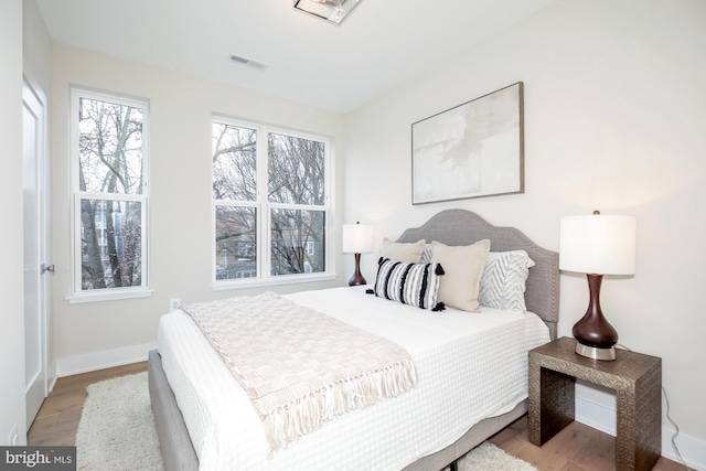 bedroom with light hardwood / wood-style flooring