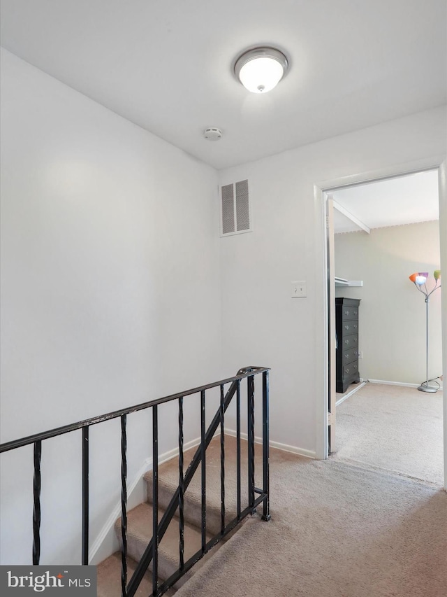 8387 Revelation Ave, Walkersville, MD 21793 - corridor with carpet, visible vents, baseboards, and an upstairs landing