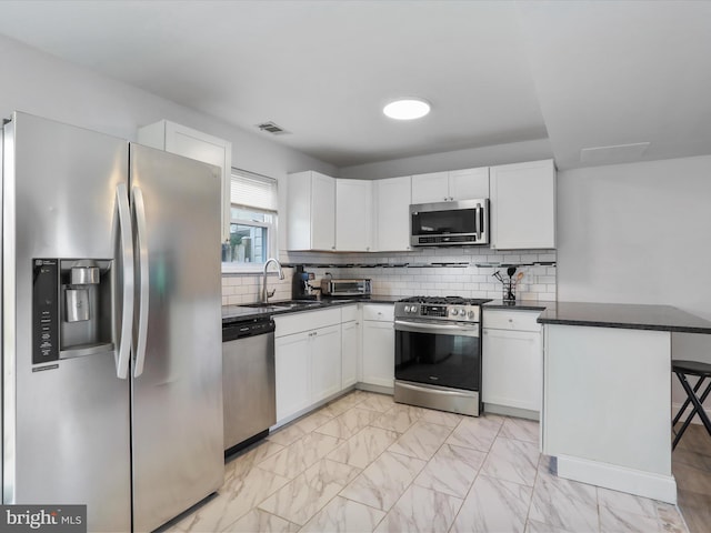 8387 Revelation Ave, Walkersville, MD 21793 - kitchen featuring white cabinets, appliances with stainless steel finishes, a sink, and visible vents
