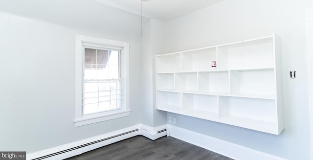 interior space with a baseboard radiator and hardwood / wood-style flooring