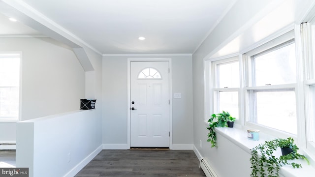 entryway featuring ornamental molding, dark hardwood / wood-style flooring, and baseboard heating