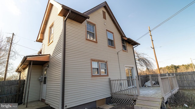 back of property featuring a deck