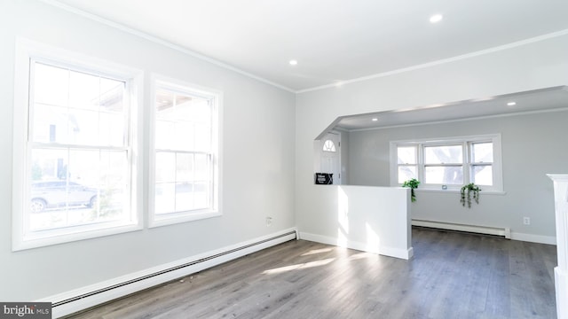 unfurnished room featuring a baseboard radiator, ornamental molding, and dark wood-type flooring