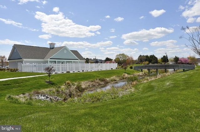 view of property's community with a yard