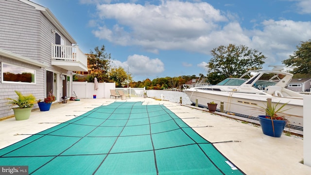 view of swimming pool featuring a patio area