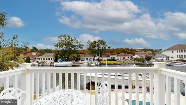 balcony featuring a water view