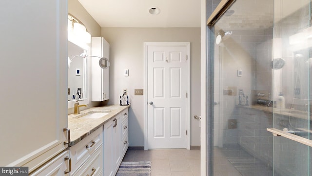 bathroom with vanity, tile patterned floors, and walk in shower