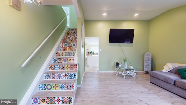 stairs with hardwood / wood-style flooring