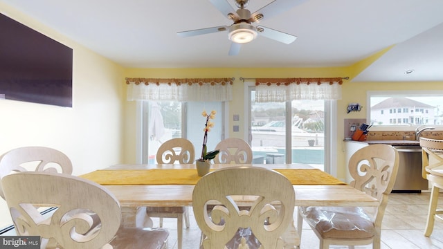 tiled dining room with ceiling fan