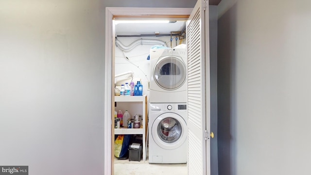 laundry room featuring stacked washer / dryer