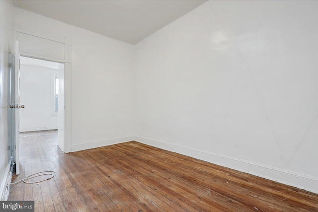 unfurnished room featuring hardwood / wood-style floors