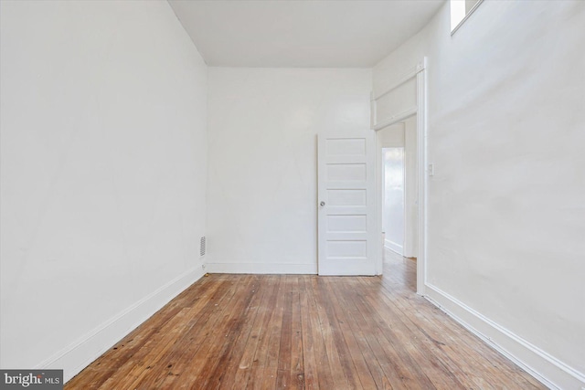 empty room featuring hardwood / wood-style flooring