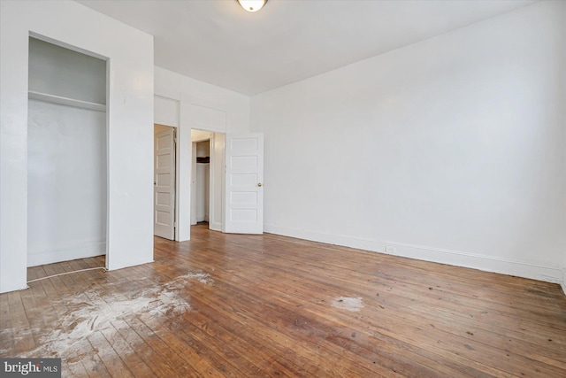 unfurnished bedroom featuring hardwood / wood-style floors