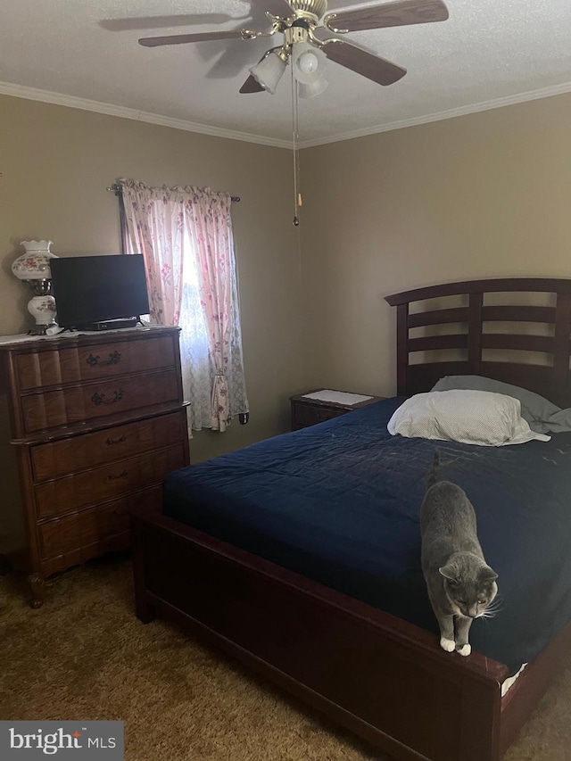 bedroom featuring ceiling fan, carpet flooring, and crown molding