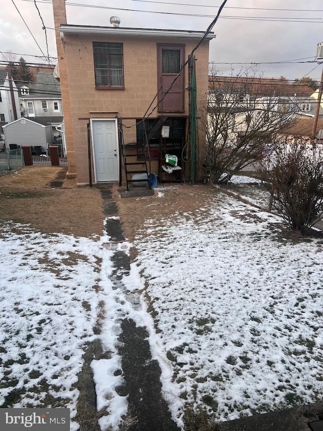 view of snow covered house