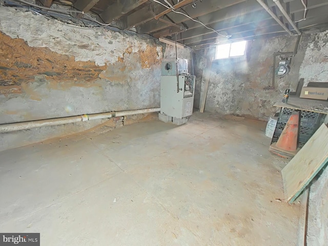 basement featuring heating unit