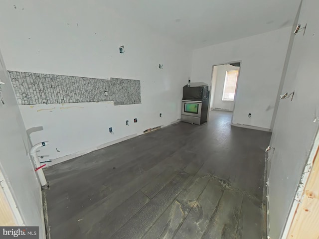 unfurnished living room with dark hardwood / wood-style flooring