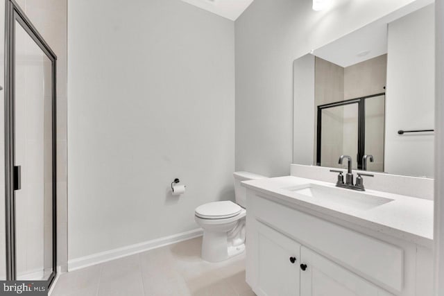 bathroom featuring vanity, toilet, tile patterned floors, and walk in shower