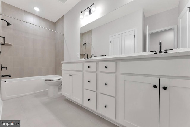 full bathroom with vanity, toilet, tile patterned floors, and tiled shower / bath