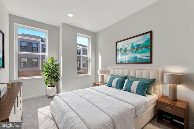 bedroom featuring light carpet