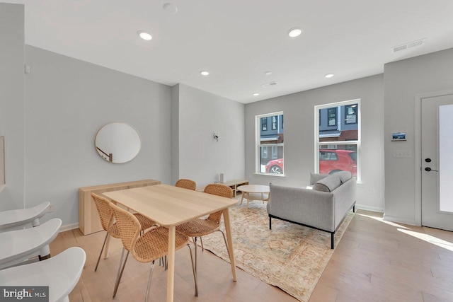 dining space featuring light hardwood / wood-style flooring