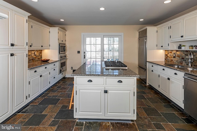 kitchen with built in appliances and white cabinets