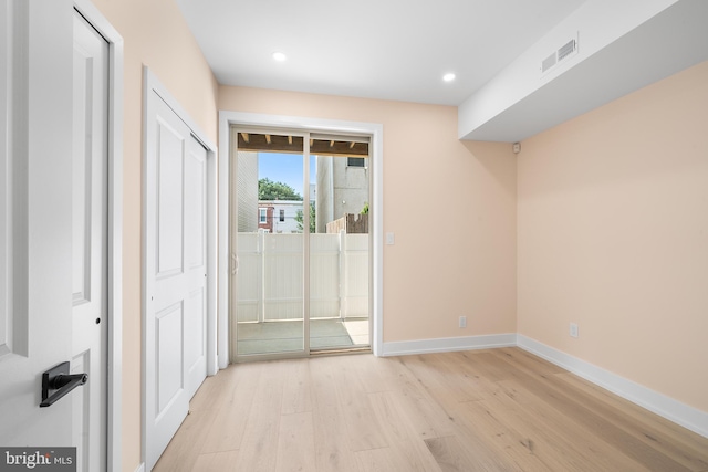 interior space featuring access to exterior and light hardwood / wood-style floors