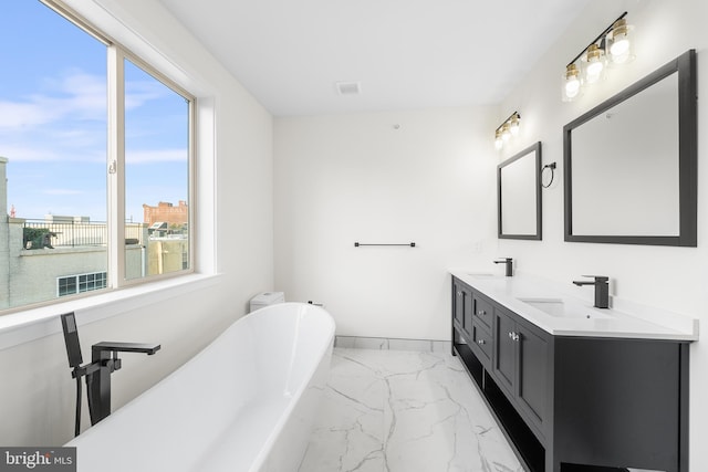 bathroom featuring a bathtub and vanity