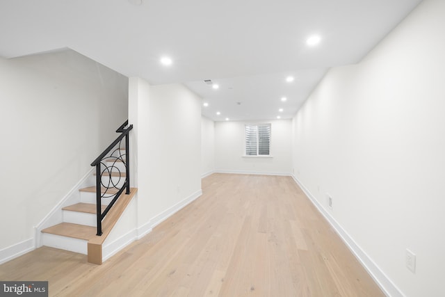 basement featuring light hardwood / wood-style flooring